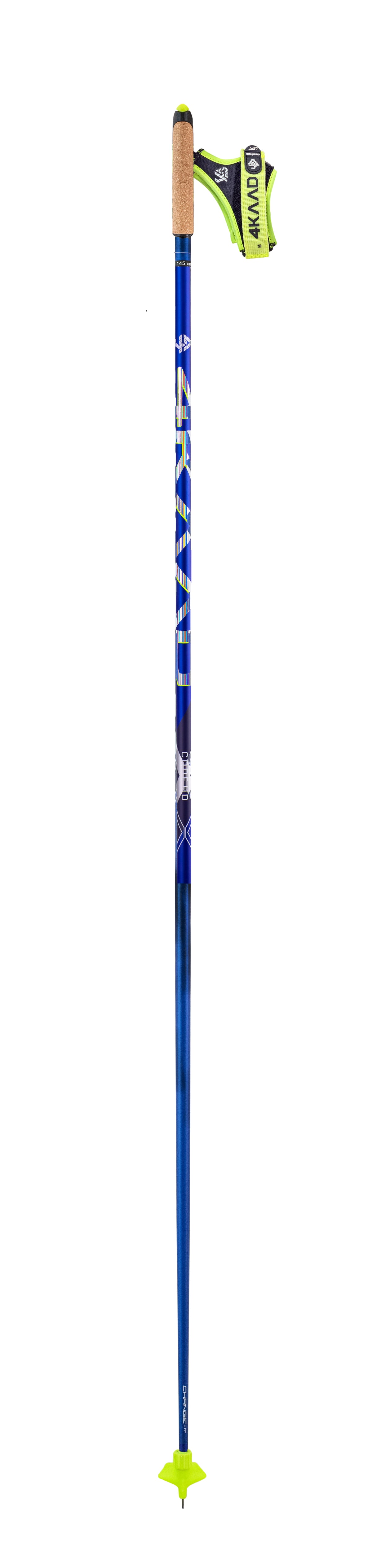 A single ski touring pole shown vertically against a plain white background. The pole shaft is predominantly blue with white and dark graphics, featuring a tan cork grip, a black and neon yellow handgrip, and a matching neon yellow tip.