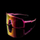 Skvado sports sunglasses with a translucent pink frame and a large shield lens featuring a yellow-to-pink gradient, shown on a reflective black surface against a black background. 4kaad eyewear products for cycling