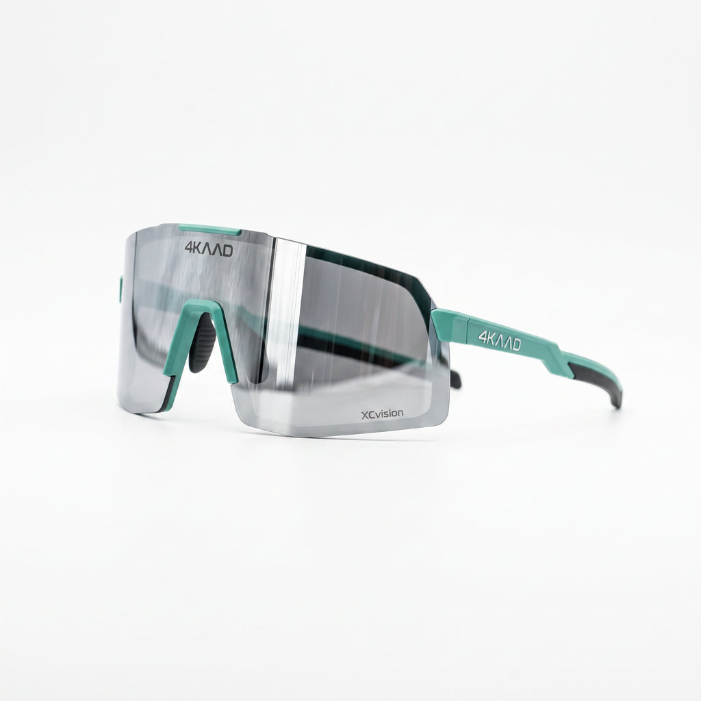 4KMD XC Vision sport sunglasses with a silver mirrored lens and teal accents on the frame and temples, shown on a clean white background.