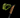 A close-up studio shot of a Nordic walking pole with a black and neon yellow-green wrist strap and a cork-textured handle grip, both branded 4KVAAD, set against a solid black background.