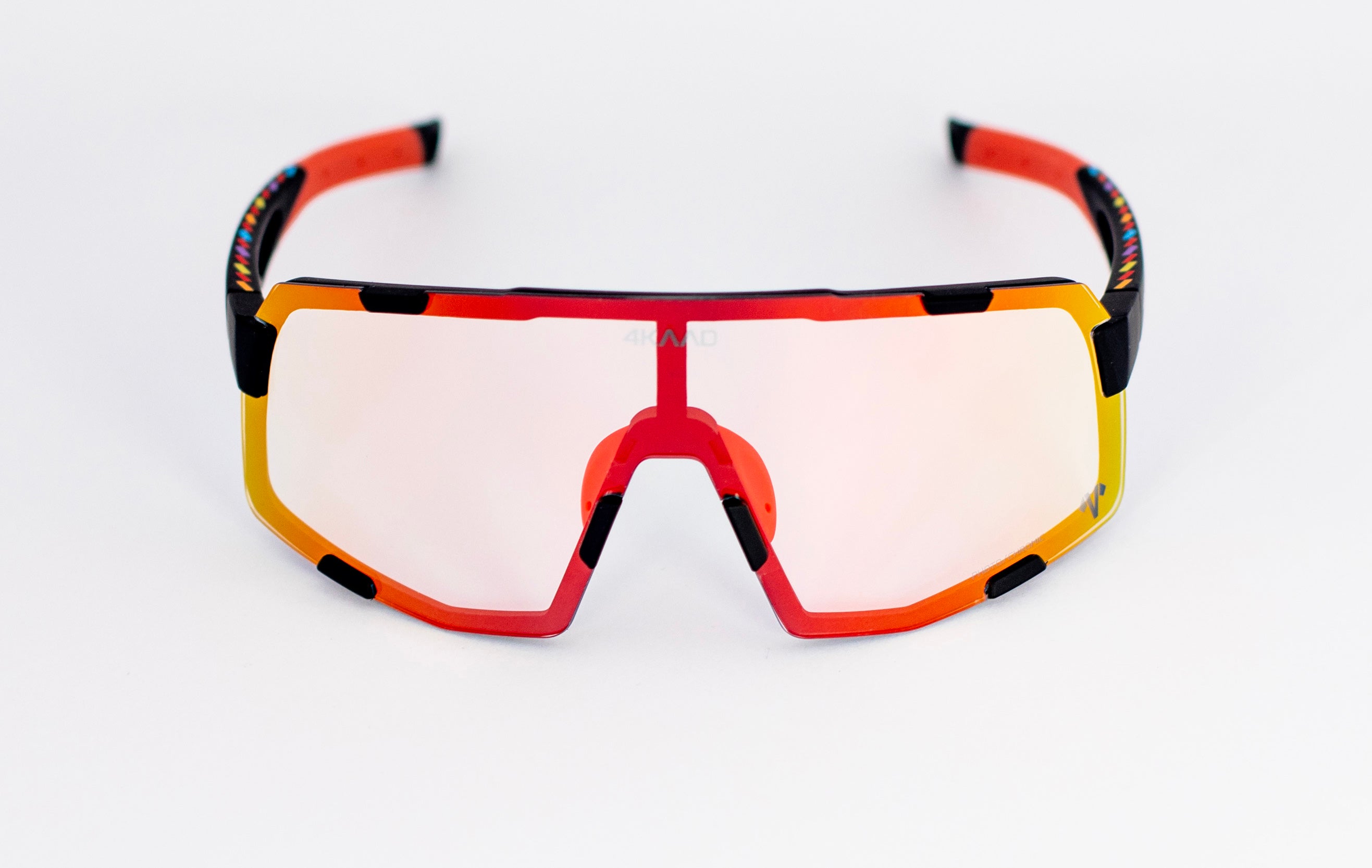 Sport sunglasses with a vibrant red, orange, and yellow gradient frame and light pink mirrored lenses, shown on a clean white background.
